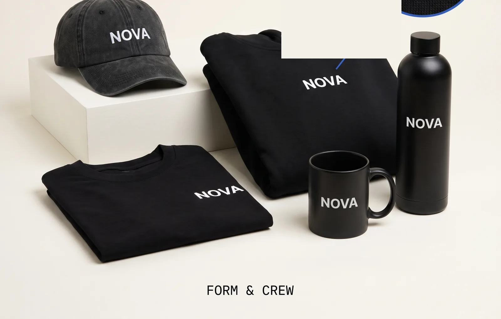 NOVA black kit: washed black cap, black hoodie, black tee, matte mug and bottle, all marked NOVA